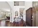 Bright foyer featuring hardwood floors, soaring ceilings, and a staircase leading to the upper level at 1595 Johnstown Trace, Suwanee, GA 30024