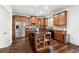 Kitchen featuring wood cabinets, an island, and stainless steel appliances at 1595 Johnstown Trace, Suwanee, GA 30024