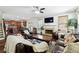 Comfortable living room featuring a fireplace and an open view of the kitchen at 1595 Johnstown Trace, Suwanee, GA 30024