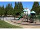 Community playground equipment and lush landscaping at 1595 Johnstown Trace, Suwanee, GA 30024