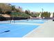 View of the community tennis courts on a sunny day at 1595 Johnstown Trace, Suwanee, GA 30024