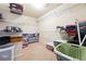 Walk-in closet with wire shelving, carpet, and storage containers at 1595 Johnstown Trace, Suwanee, GA 30024