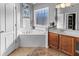 This primary bathroom features a large soaking tub and a window that provides natural light at 310 Persimmon Dr, Sharpsburg, GA 30277