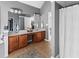 Spacious bathroom with double sinks, wood cabinets, and a separate shower area at 310 Persimmon Dr, Sharpsburg, GA 30277