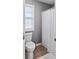 Cozy bathroom featuring a toilet, window and shower with curtain at 310 Persimmon Dr, Sharpsburg, GA 30277