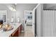 This large primary bathroom features double sinks and connects to the main bedroom at 310 Persimmon Dr, Sharpsburg, GA 30277