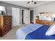 Bedroom featuring carpet, blue bedding and hardwood furniture at 310 Persimmon Dr, Sharpsburg, GA 30277