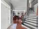 Spacious foyer with hardwood floors, staircase and an open view of the living spaces at 310 Persimmon Dr, Sharpsburg, GA 30277