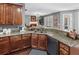 Granite countertops and wood cabinets complete this eat-in kitchen at 310 Persimmon Dr, Sharpsburg, GA 30277