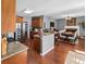The kitchen is steps away from a breakfast nook and sitting area with a fireplace at 310 Persimmon Dr, Sharpsburg, GA 30277
