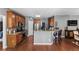 Eat-in kitchen features wood cabinets, stainless appliances, and granite countertops at 310 Persimmon Dr, Sharpsburg, GA 30277