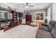 Bright living room featuring hardwood floors, a neutral rug, and recessed lighting at 310 Persimmon Dr, Sharpsburg, GA 30277