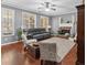 Cozy living room with a fireplace, comfortable seating and hardwood floors at 310 Persimmon Dr, Sharpsburg, GA 30277