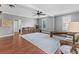 Open-concept living area with a large area rug, table with stools, and an abundance of natural light at 310 Persimmon Dr, Sharpsburg, GA 30277
