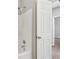 Well-lit bathroom features a shower/tub combination with modern fixtures and a white door at 3100 Plantation Run Dr, Loganville, GA 30052