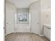 Bright bathroom with natural light, two doors, and soaking tub at 3100 Plantation Run Dr, Loganville, GA 30052