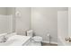 Clean bathroom with a white vanity, toilet, and shower, providing a functional and tidy space at 3100 Plantation Run Dr, Loganville, GA 30052