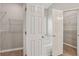 Bright bathroom featuring dual walk-in closets and a soaking tub at 3100 Plantation Run Dr, Loganville, GA 30052