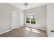 Bright bedroom features a window view and two doors, and attractive floors at 3100 Plantation Run Dr, Loganville, GA 30052