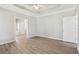 Neutral bedroom with light wood flooring and ceiling fan at 3100 Plantation Run Dr, Loganville, GA 30052