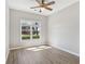 Well-lit bedroom with ample natural light and view of manicured outdoor scenery at 3100 Plantation Run Dr, Loganville, GA 30052