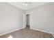 Neutral bedroom with light wood flooring and ceiling fan at 3100 Plantation Run Dr, Loganville, GA 30052