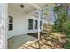 Covered entry to this home with white siding and three windows and small walkway at 3100 Plantation Run Dr, Loganville, GA 30052