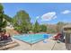 Community swimming pool surrounded by trees and lounge chairs at 3100 Plantation Run Dr, Loganville, GA 30052