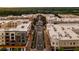 Aerial view of a commercial area with retail stores, restaurants, and a central thoroughfare at 7220 Summit Pl, Alpharetta, GA 30009