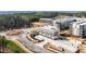 Aerial view of a modern townhome community with manicured landscaping and convenient parking at 7220 Summit Pl, Alpharetta, GA 30009