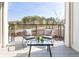 Cozy balcony featuring comfortable seating and a tranquil view of lush greenery at 7220 Summit Pl, Alpharetta, GA 30009