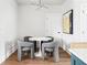 Cozy dining area with a round table and chairs, perfect for intimate meals at 7220 Summit Pl, Alpharetta, GA 30009