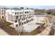 Contemporary townhome boasts multi-story architecture, private garages, and professionally landscaped grounds at 7220 Summit Pl, Alpharetta, GA 30009