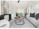 Inviting open-concept living area with stylish decor, connecting seamlessly to the kitchen at 7220 Summit Pl, Alpharetta, GA 30009