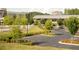 Well-maintained parking lot surrounded by lush greenery, sidewalks, and a variety of trees and plants at 7220 Summit Pl, Alpharetta, GA 30009