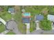 An aerial perspective of the property featuring a sparkling blue in-ground pool at 10540 Willow View Cir, Alpharetta, GA 30022