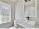 Stylish powder room with modern sink and natural light at 10540 Willow View Cir, Alpharetta, GA 30022