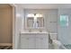 Stylish bathroom features double vanity and a glass enclosed shower at 10540 Willow View Cir, Alpharetta, GA 30022