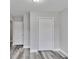 Bright bedroom with wood floors and double door closet at 10540 Willow View Cir, Alpharetta, GA 30022