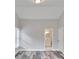 Bright bedroom features gray-toned wood floors and bathroom access at 10540 Willow View Cir, Alpharetta, GA 30022