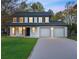 Charming two-story home with a manicured lawn and an attached two-car garage at 10540 Willow View Cir, Alpharetta, GA 30022