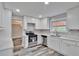 Updated kitchen with stainless steel appliances, bright countertops, and ample cabinetry at 10540 Willow View Cir, Alpharetta, GA 30022