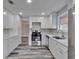 Modern kitchen with white cabinets, stainless steel appliances, and stylish countertops at 10540 Willow View Cir, Alpharetta, GA 30022