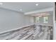 Spacious living room featuring wood floors, neutral walls, and recessed lighting for a modern aesthetic at 10540 Willow View Cir, Alpharetta, GA 30022