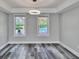 Living room with contemporary lighting and view of backyard pool area at 10540 Willow View Cir, Alpharetta, GA 30022