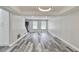 Open living room with new flooring, modern lighting, and neutral color scheme, creating a stylish space at 10540 Willow View Cir, Alpharetta, GA 30022