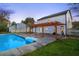 A refreshing in-ground swimming pool and covered outdoor patio are backyard highlights at 10540 Willow View Cir, Alpharetta, GA 30022
