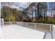 Beautiful home features a spacious deck with white railing, perfect for outdoor enjoyment at 2562 Tritt Springs Ne Trce, Marietta, GA 30062