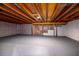 Unfinished basement with concrete floor, exposed beams and white painted walls at 2562 Tritt Springs Ne Trce, Marietta, GA 30062