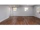 Basement living area with wood-look floors, neutral paint, and a door leading to the exterior at 2562 Tritt Springs Ne Trce, Marietta, GA 30062